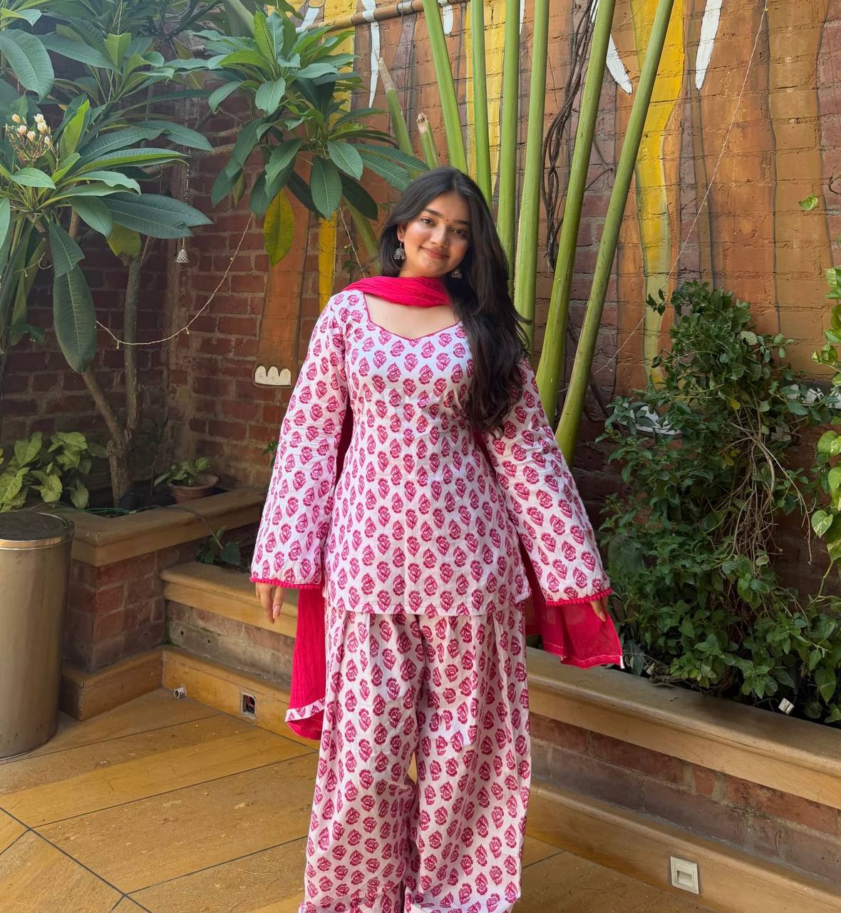 Charming Pink Floral Block Print Peplum Kurti and Wide-Leg Palazzo Suit Set Featuring an Elegant Tie-Up Back and Solid Vibrant Dupatta